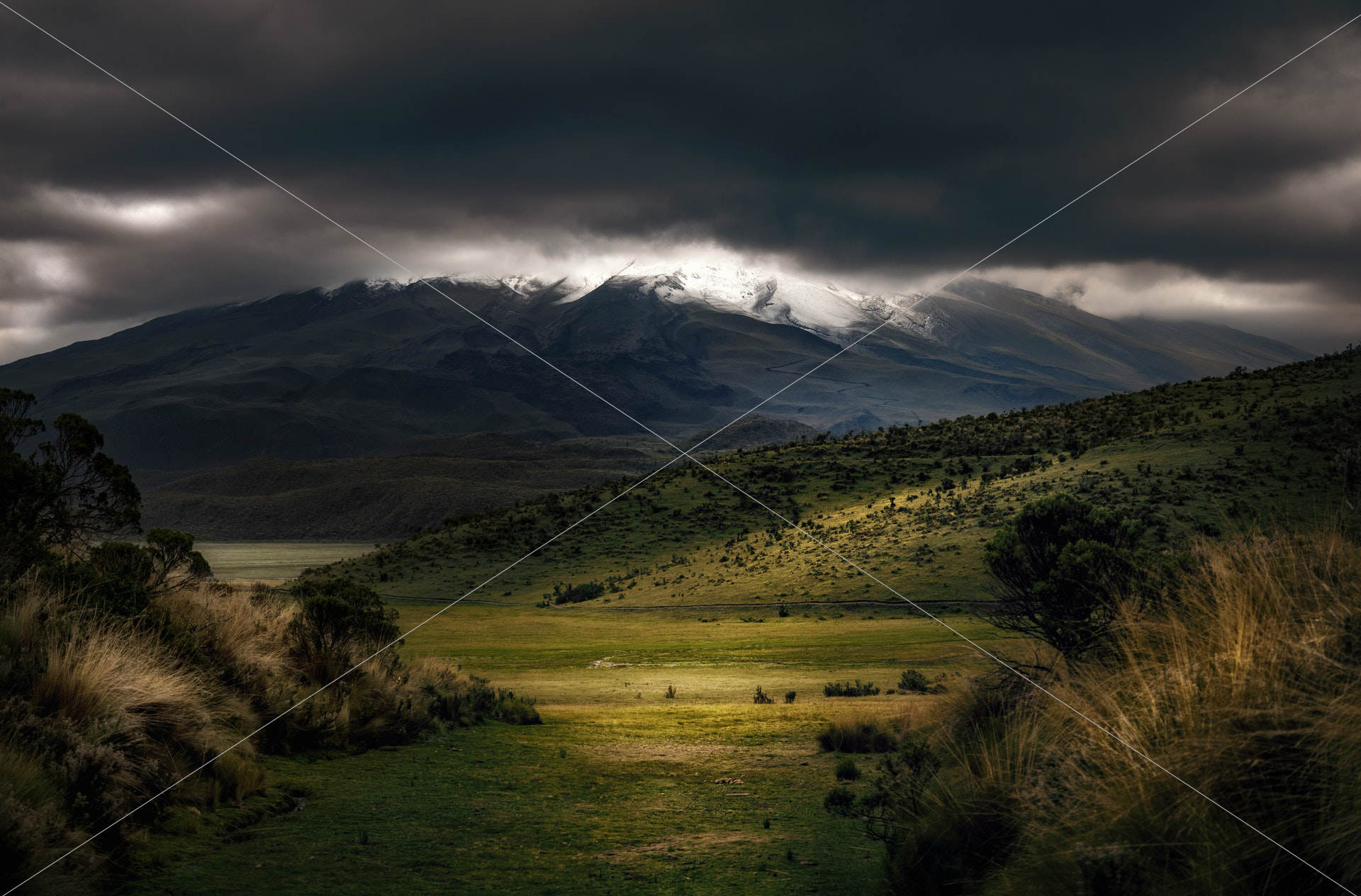 mountains under cloudy sky